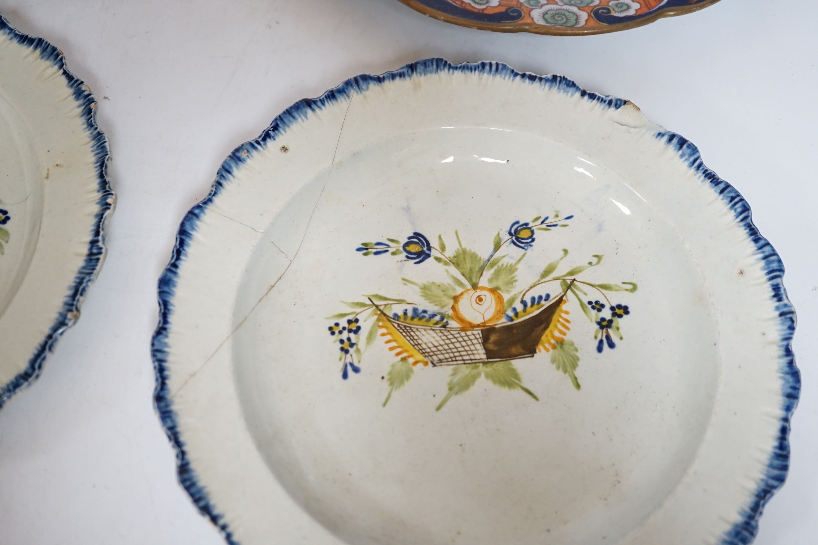 Two late 18th century pearlware Prattware plates, a Chinese export plate and an ironstone plate, largest 27cm in diameter